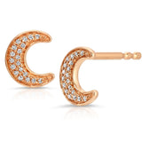 A pair of rose gold pave diamond crescent moon stud earring on a white background.