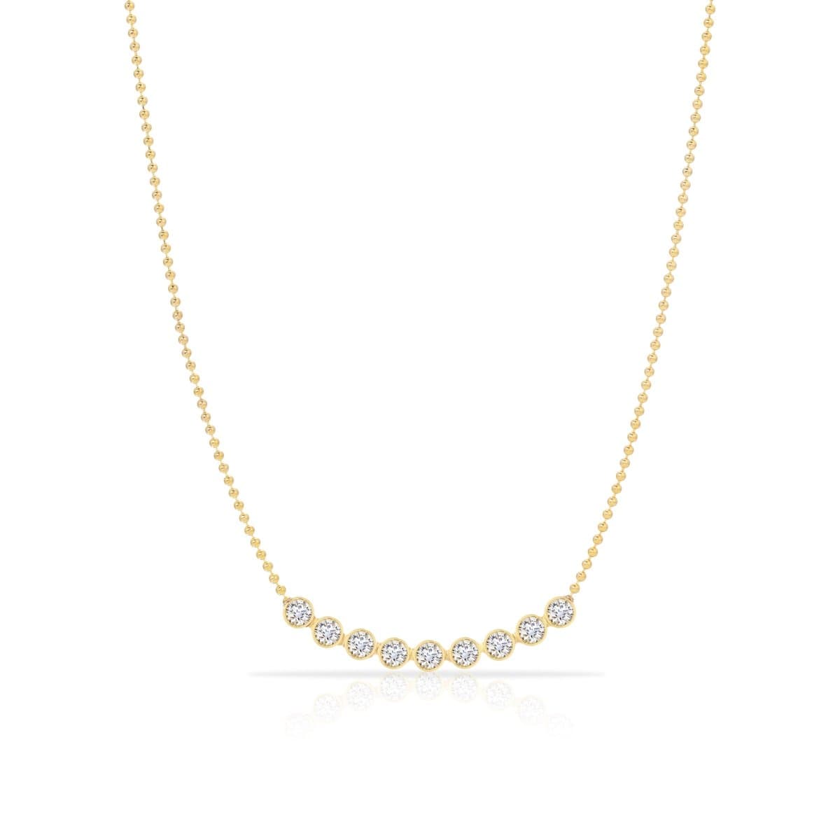 A Birthstone Arc Layering Necklace – Yellow Gold in Diamond – April on a white background.