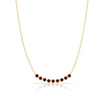 A Birthstone Arc Layering Necklace – Yellow Gold in Garnet – January on a white background.