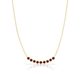 A Birthstone Arc Layering Necklace – Yellow Gold in Garnet – January on a white background.