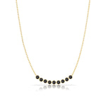 A Birthstone Arc Layering Necklace – Yellow Gold in Onyx – August on a white background.