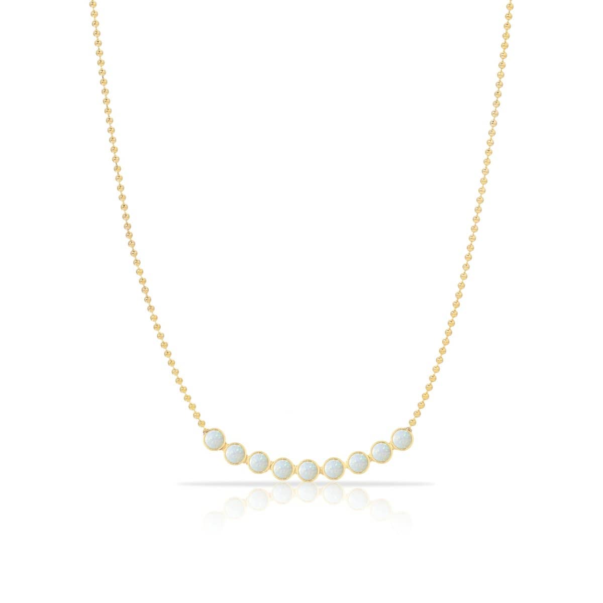 A Birthstone Arc Layering Necklace – Yellow Gold in Opal – October on a white background.
