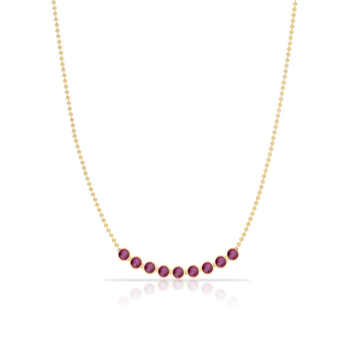 A Birthstone Arc Layering Necklace – Yellow Gold in Ruby – July on a white background.