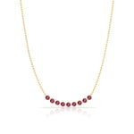 A Birthstone Arc Layering Necklace – Yellow Gold in Ruby – July on a white background.