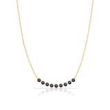 A Birthstone Arc Layering Necklace – Yellow Gold in Sapphire – September on a white background. 