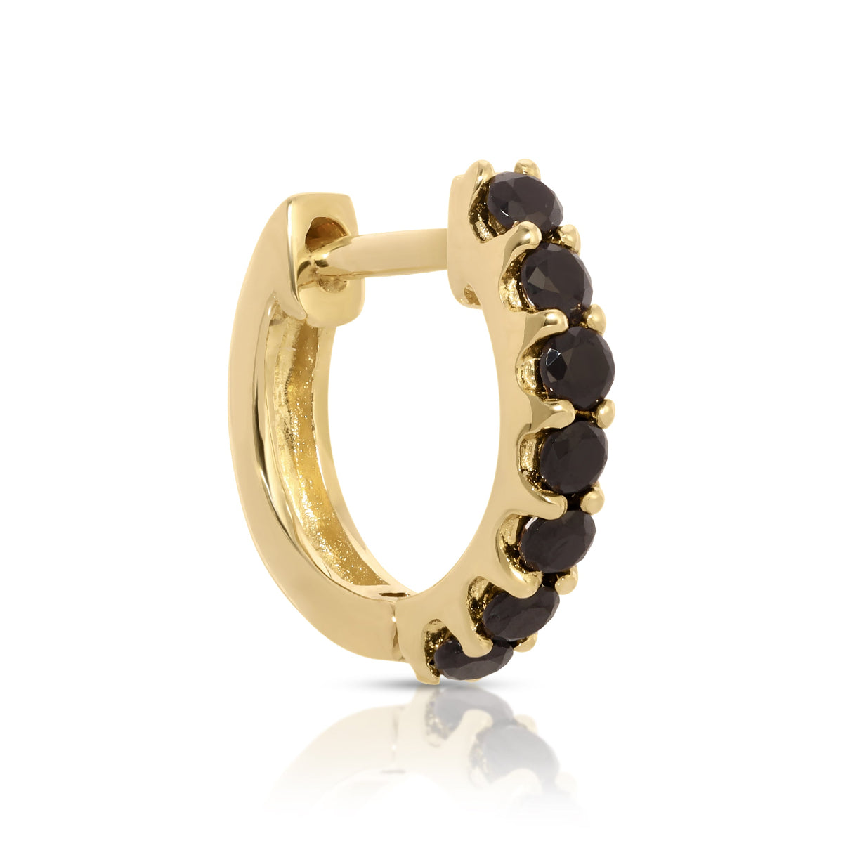 A single gold hoop earring with black onyx stones set around its circumference.
