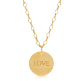 The back of a Virtues Pendant - Circle in yellow gold with 'LOVE' engraved on a white background. 