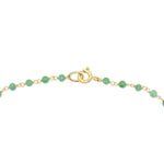 The clasp closure of the Clover Bouquet Necklace on a white background. 