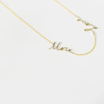 A More Love Necklace on a white background. 