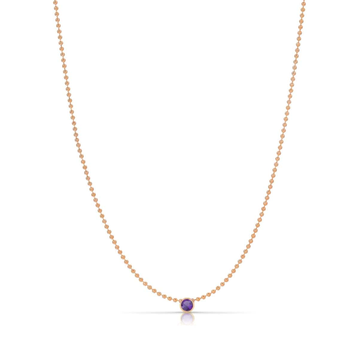 A Single Birthstone Layering Necklace - Rose Gold in Amethyst on a white background.