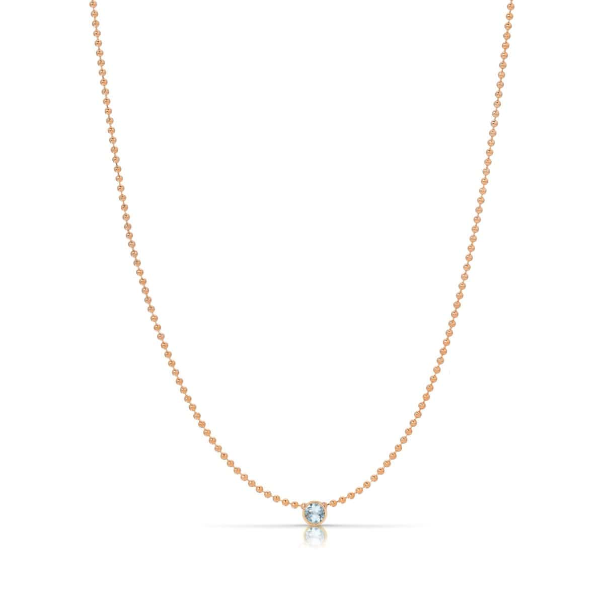 A Single Birthstone Layering Necklace - Rose Gold in Aquamarine on a white background.