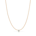 A Single Birthstone Layering Necklace - Rose Gold in Aquamarine on a white background.