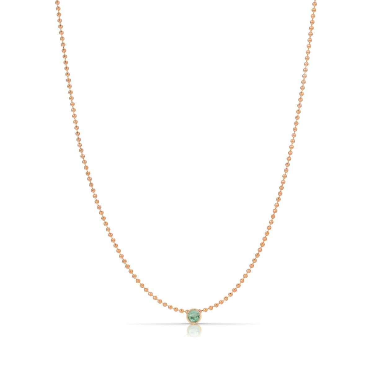 A Single Birthstone Layering Necklace - Rose Gold in Emerald on a white background. 