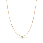 A Single Birthstone Layering Necklace - Rose Gold in Emerald on a white background. 