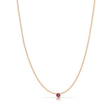 A Single Birthstone Layering Necklace - Rose Gold in Ruby on a white background.