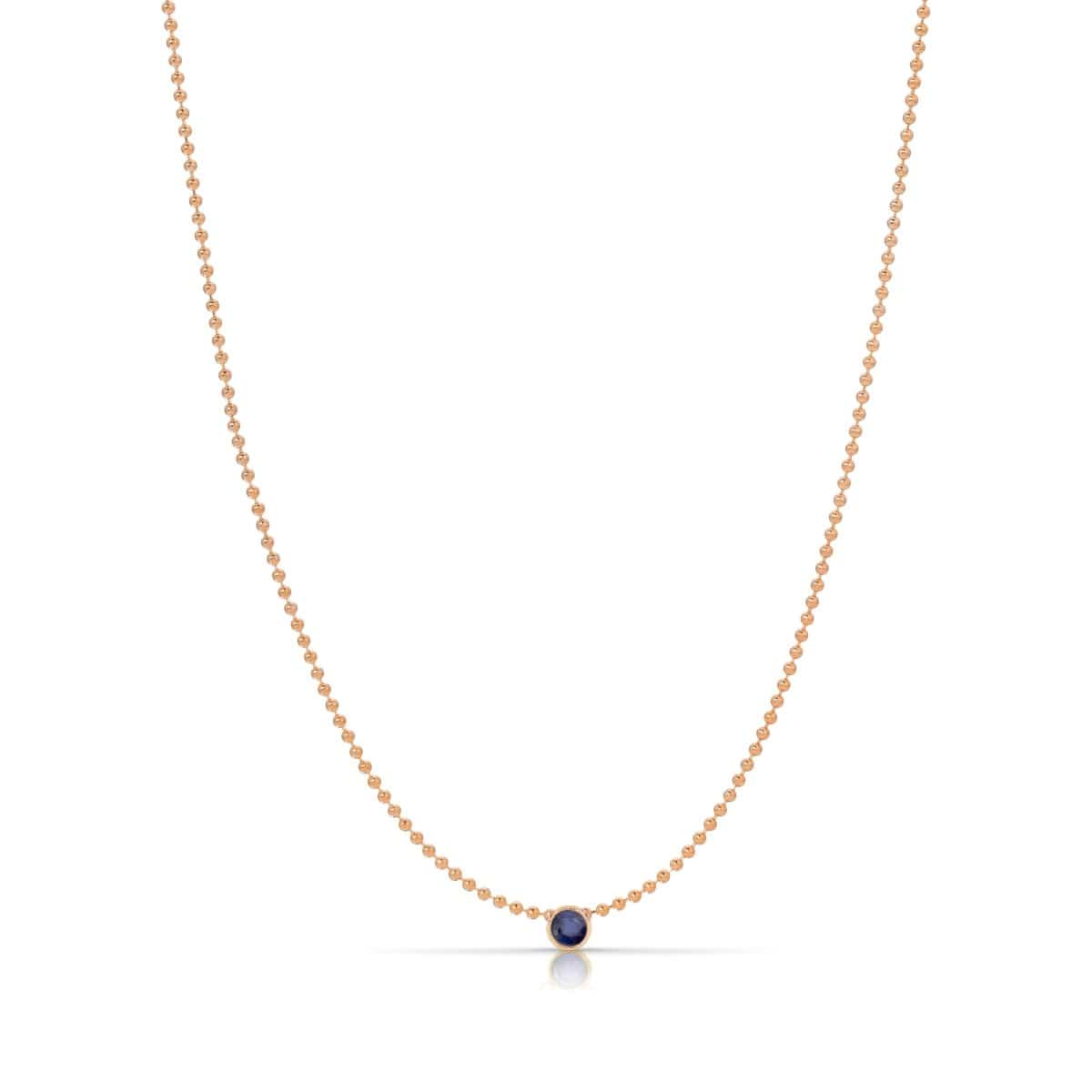 A Single Birthstone Layering Necklace - Rose Gold in Sapphire on a white background.
