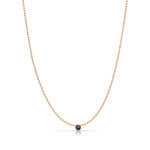 A Single Birthstone Layering Necklace - Rose Gold in Sapphire on a white background.