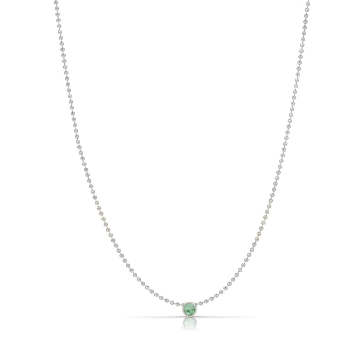A Single Birthstone Layering Necklace - White Gold in Emerald on a white background.
