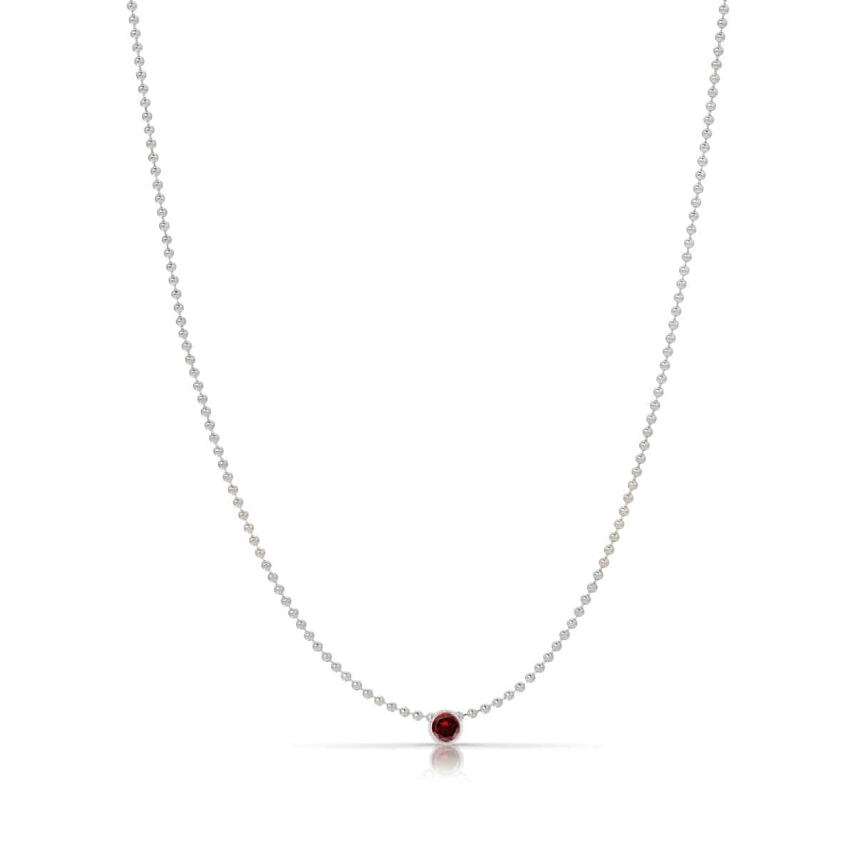 A Single Birthstone Layering Necklace - White Gold in Garnet on a white background.