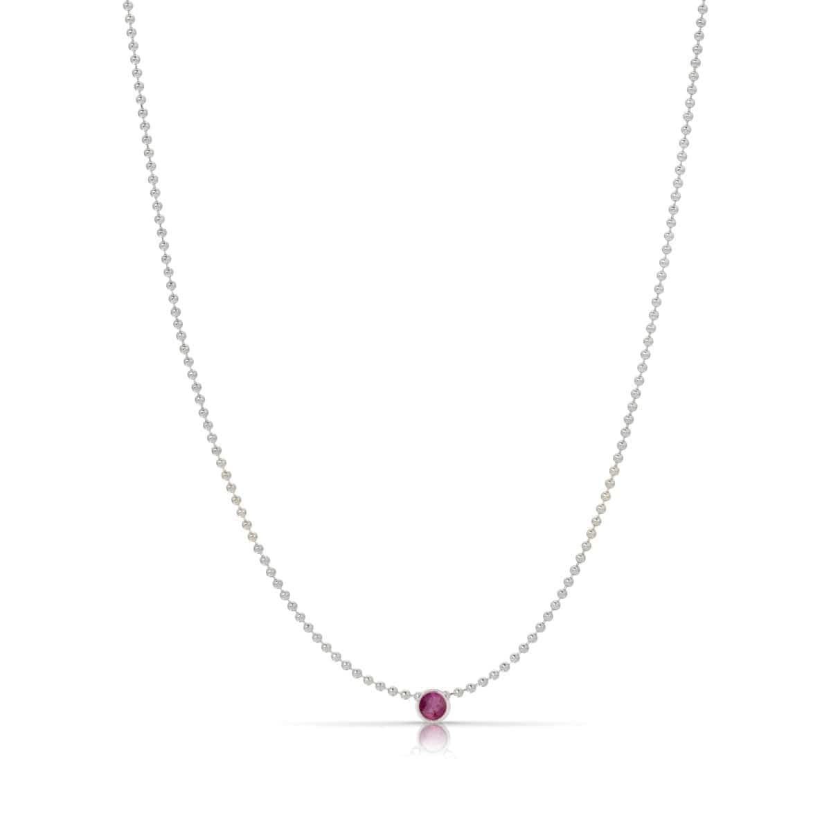 A Single Birthstone Layering Necklace - White Gold in Ruby on a white background.