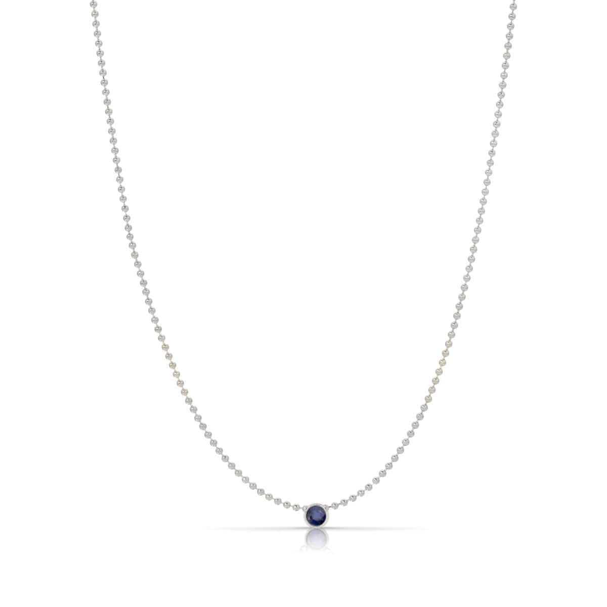 A Single Birthstone Layering Necklace - White Gold in Sapphire on a white background.