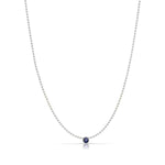A Single Birthstone Layering Necklace - White Gold in Sapphire on a white background.