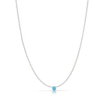 A Single Birthstone Layering Necklace - White Gold in Turquoise on a white background.