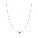 A Single Birthstone Layering Necklace - Yellow Gold in Amethyst - February on a white background.