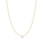 A Single Birthstone Layering Necklace - Yellow Gold in Moonstone - June on a white background.