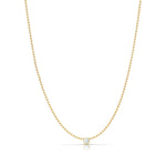 A Single Birthstone Layering Necklace - Yellow Gold in Opal - October on a white background. 