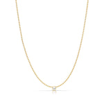 A Single Birthstone Layering Necklace - Yellow Gold in Pearl - June on a white background.