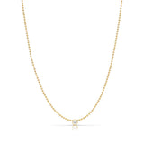 A Single Birthstone Layering Necklace - Yellow Gold in Pearl - June on a white background.
