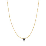 A Single Birthstone Layering Necklace - Yellow Gold in Sapphire - September on a white background.