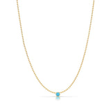 A Single Birthstone Layering Necklace - Yellow Gold in Turquoise - December on a white background.