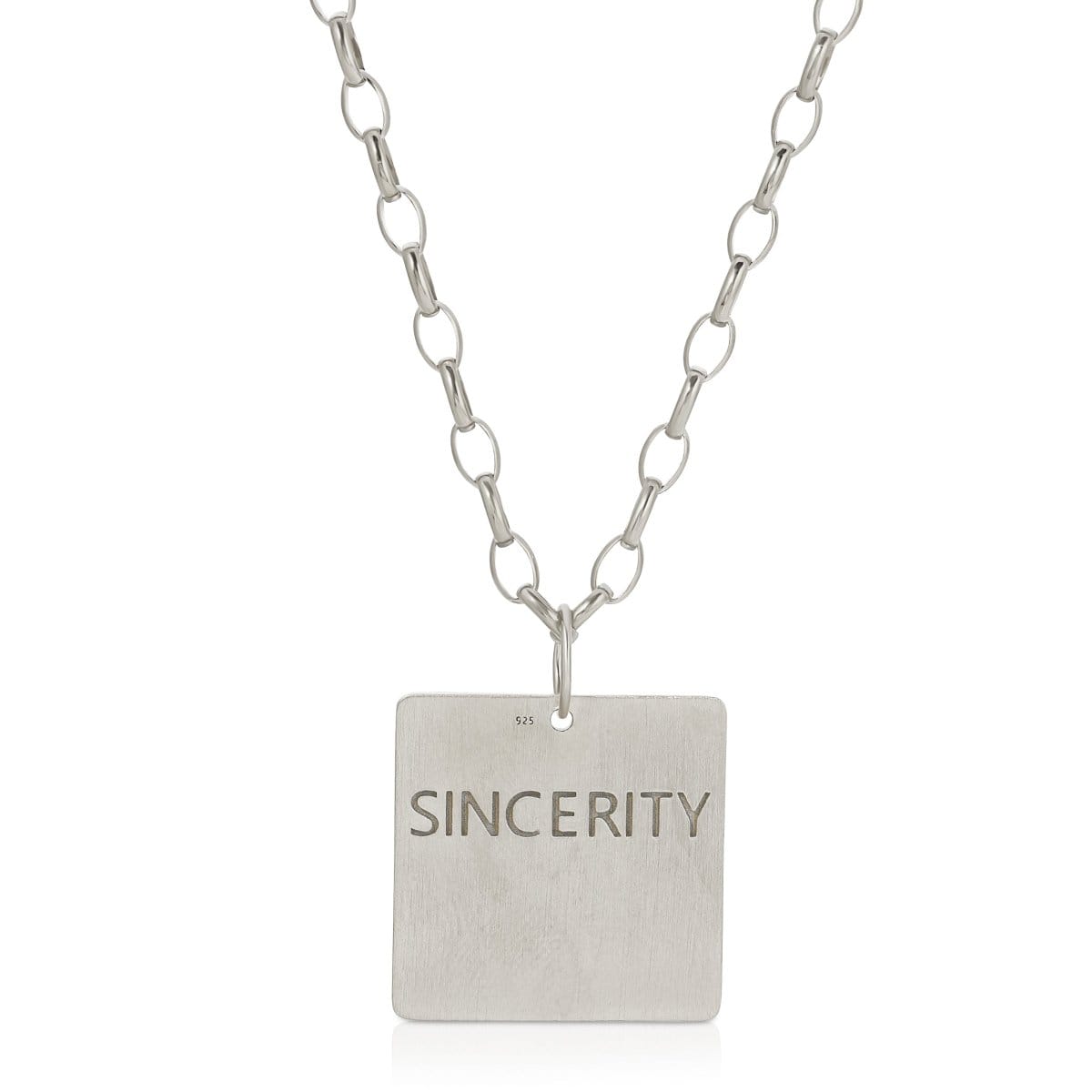 The back of a Virtues Pendant - Square in sterling silver with 'SINCERITY' engraved on a white background. 