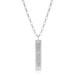 The back of a Virtues Pendant - Rectangle in sterling silver with 'DECISION' engraved on a white background. 