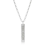 The back of a Virtues Pendant - Rectangle in sterling silver with 'DECISION' engraved on a white background. 