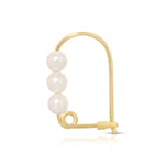 A Tres Pearl Earring on a white background. 