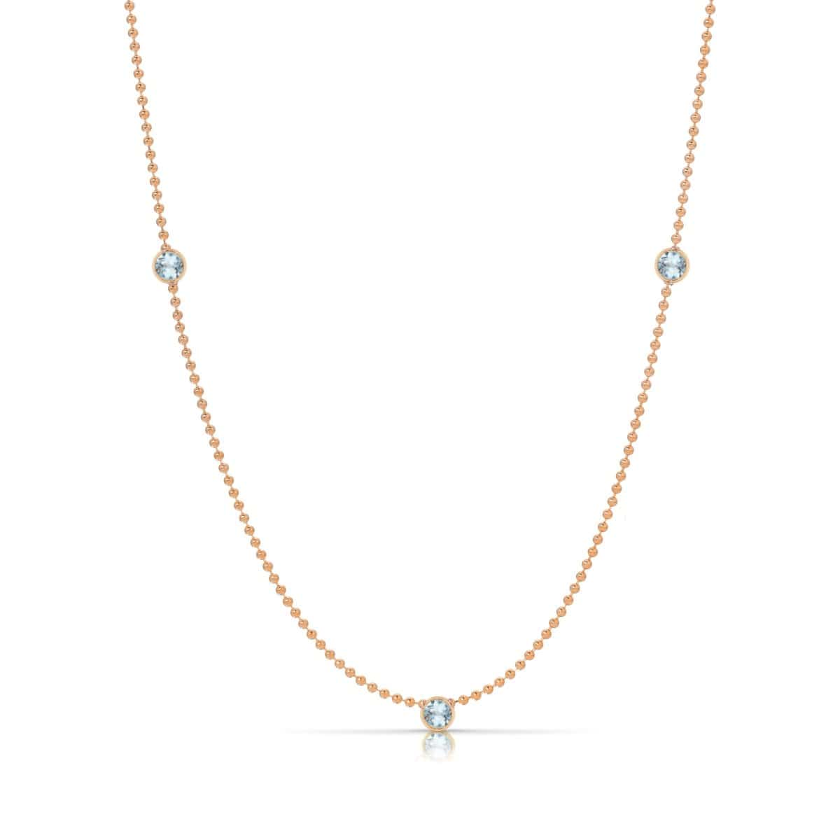 A Triple Birthstone Layering Necklace - Rose Gold in Aquamarine - March on a white background.