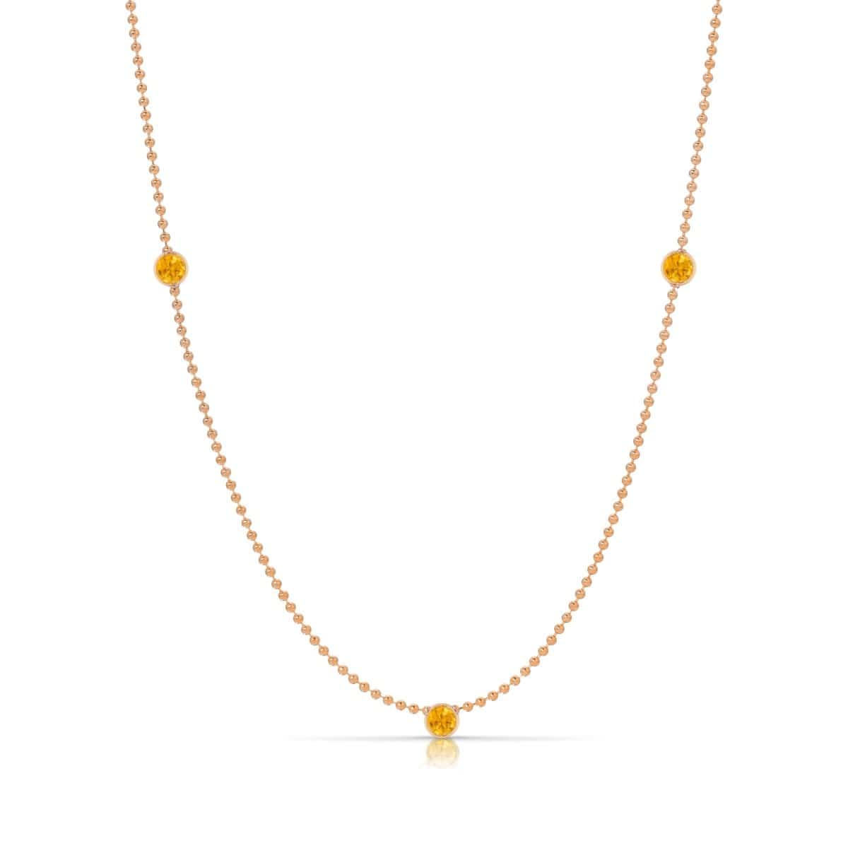 A Triple Birthstone Layering Necklace - Rose Gold in Citrine - November on a white background.