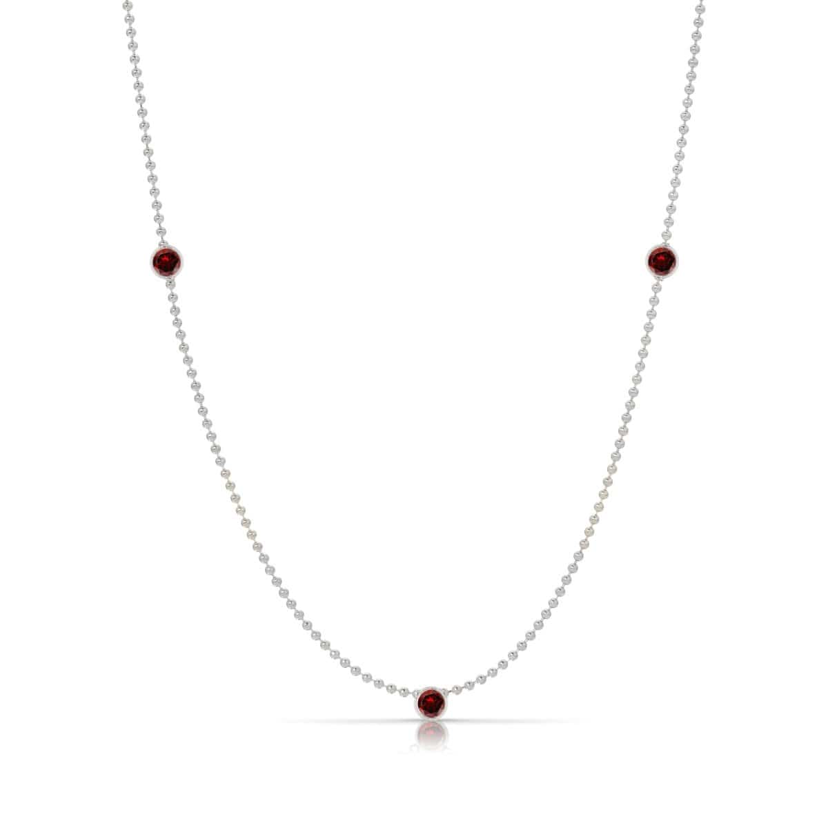 A Triple Birthstone Layering Necklace - White Gold in Garnet - January on a white background.