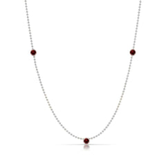 A Triple Birthstone Layering Necklace - White Gold in Garnet - January on a white background.
