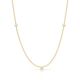 A Triple Birthstone Layering Necklace - Yellow Gold in Pearl - June on a white background.