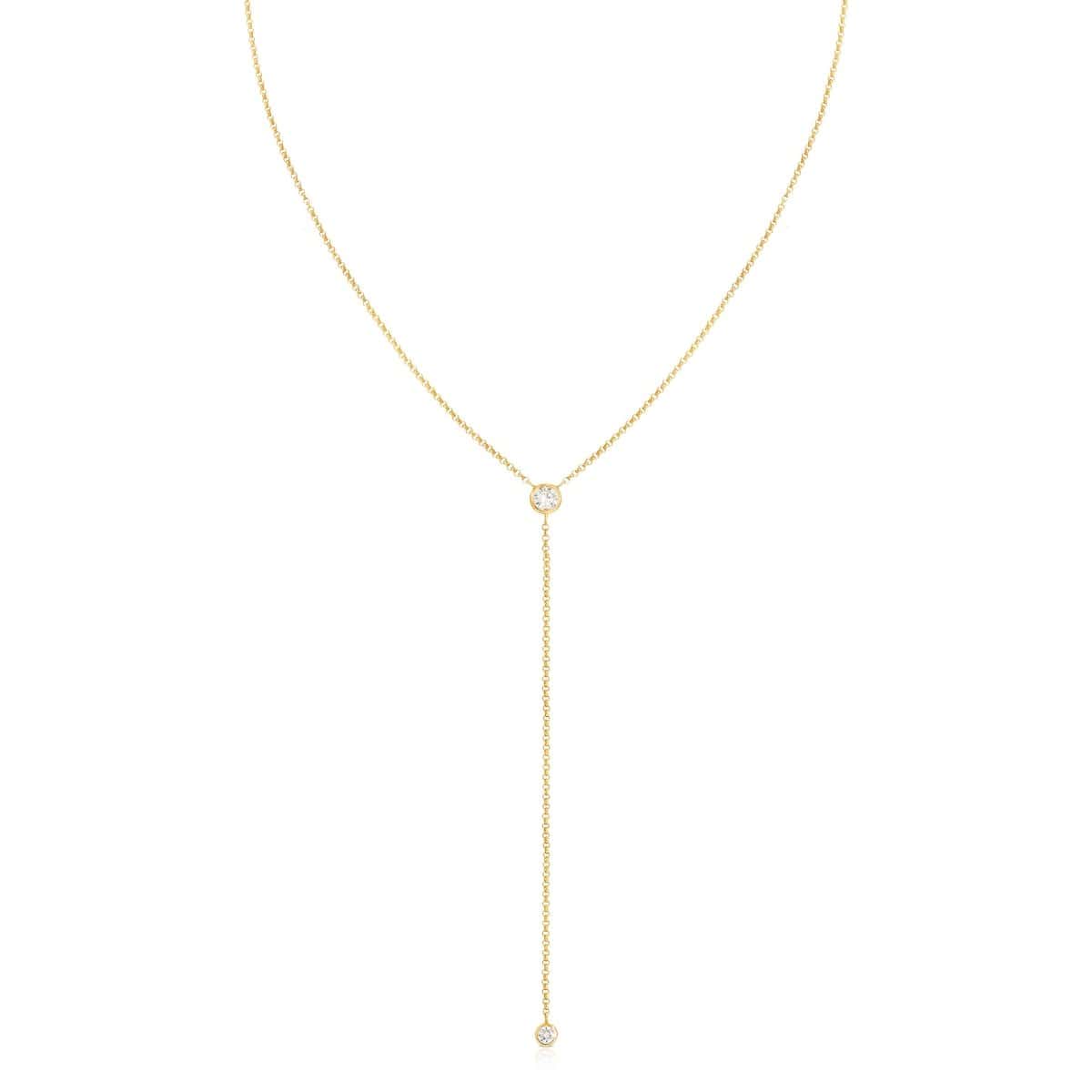 A Diamond Drip Necklace in yellow gold on a white background. 