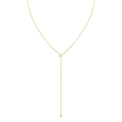 A Diamond Drip Necklace in yellow gold on a white background. 