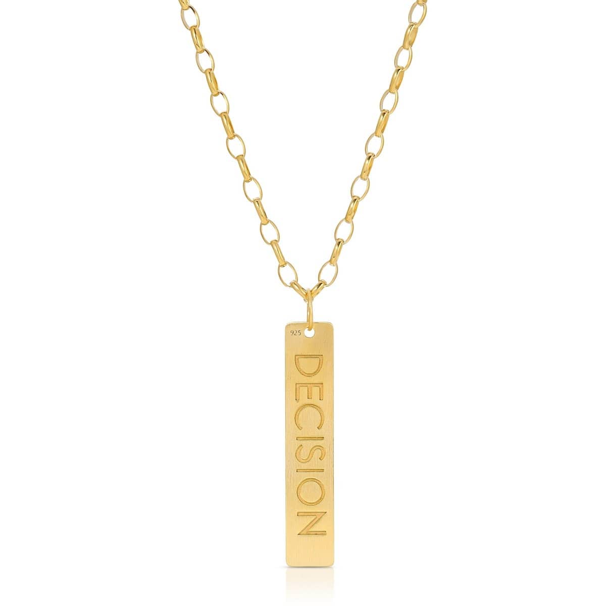 The back of a Virtues Pendant - Rectangle in yellow gold with 'DECISION' engraved on a white background. 
